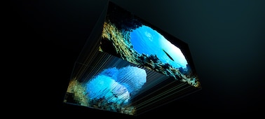 Image of XR Backlight Master Drive focusing light to control Mini LEDs with a screenshot of sea and rocks angled above