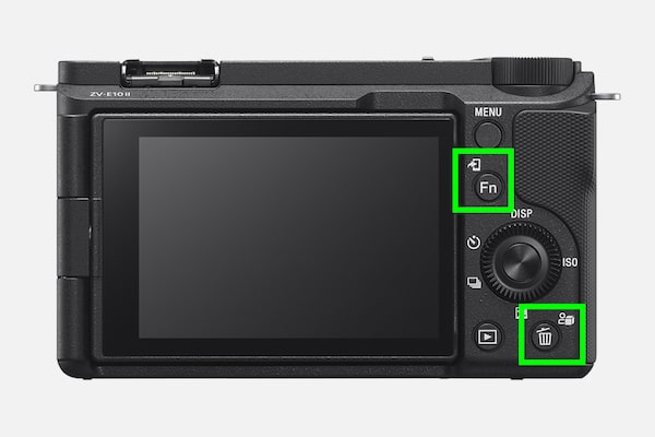 Product image of the camera's rear side with the Transfer to Smartphone button and C buttons indicated with green squares