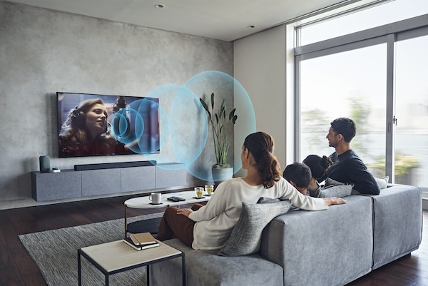 Image of couple in living room watching BRAVIA TV with Acoustic Center Sync