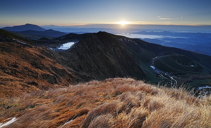 A magnificent scenery of the sunrise over the mountain. Flare, ghosting and colour bleeding are subdued for clarity